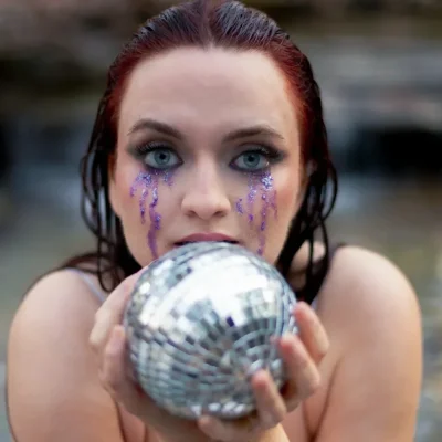 Scarlet O'Hara holding a mirror ball